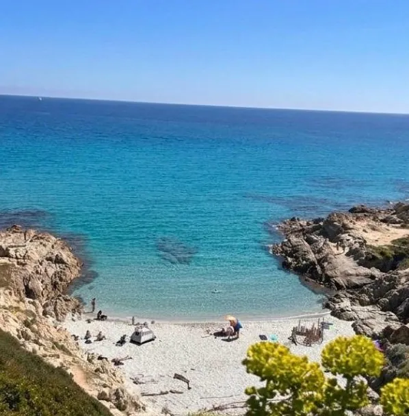 A small sandy cove between rocks